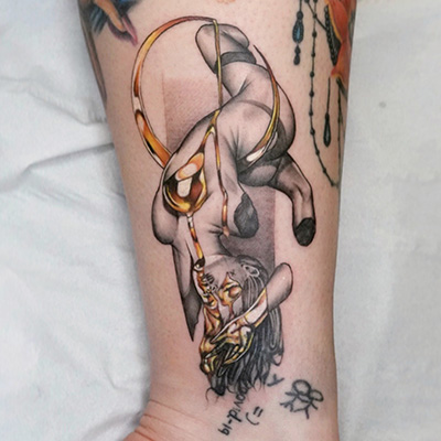Gold effect stone feminine tattoo by Rick Shaw